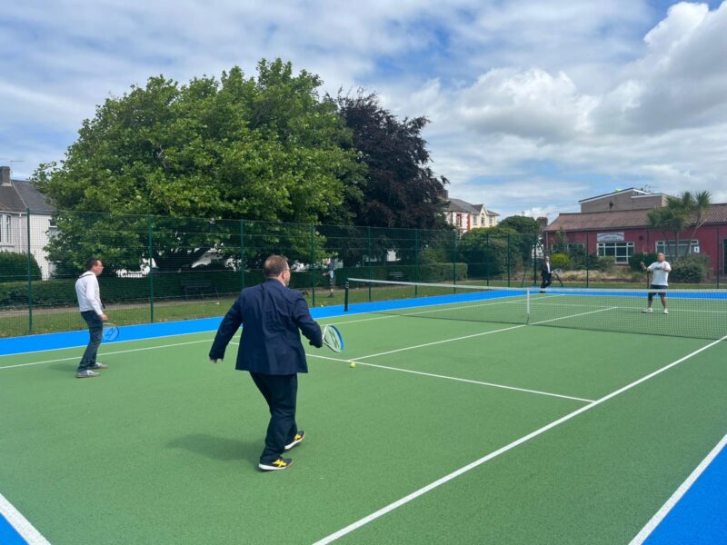 Chris and the Mayor showing their tennis skills.