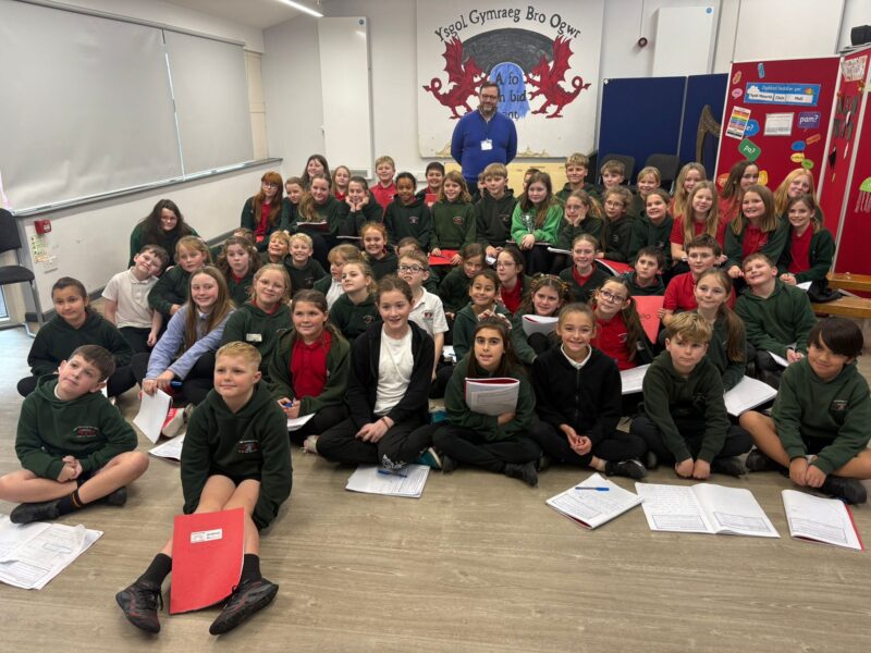 Chris with children at Ysgol Gynradd Gymraeg Bro Ogwr.