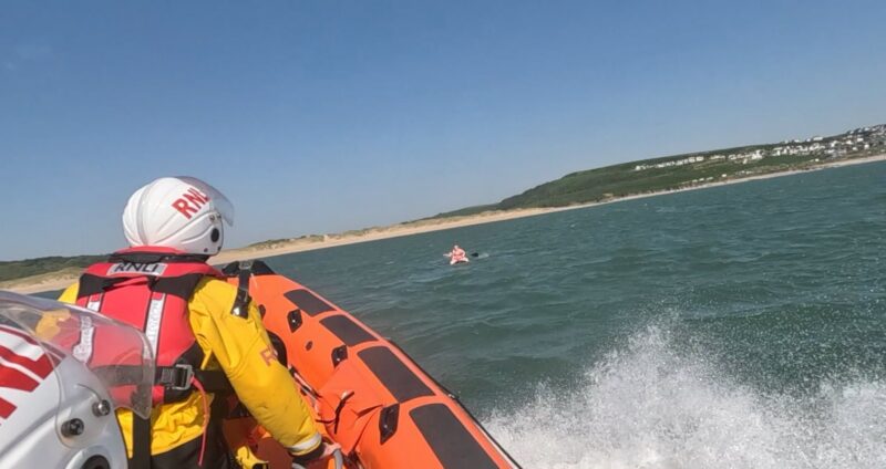Rescuing paddleboarders off the Porthcawl coast.